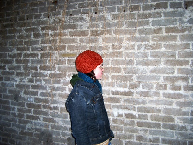 Against the wall